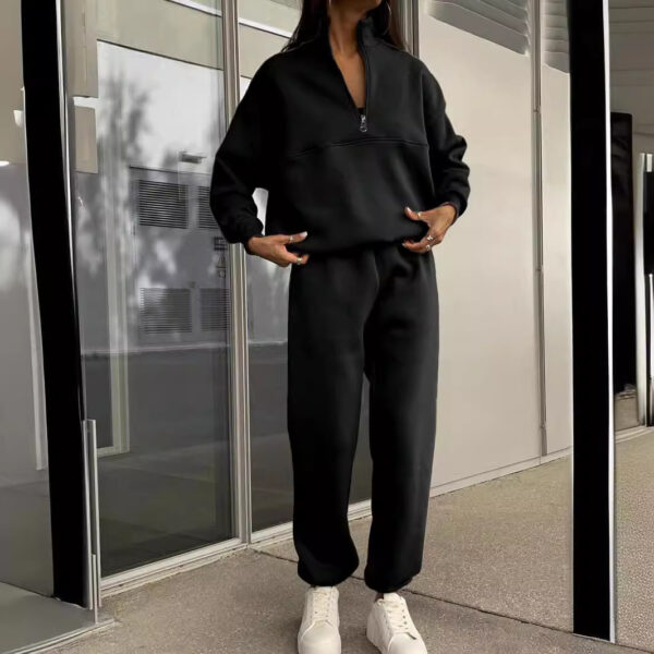 Long-sleeved sports sweatshirt suit featuring a fashionable stand-up collar, zip-up top, and elastic band trousers pockets.